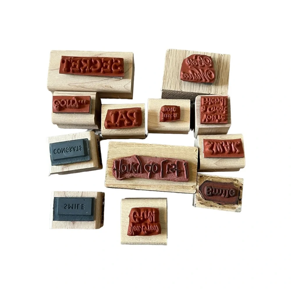 Lot of 12 mini word rubber stamps. Most of the stamps are brand new.